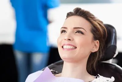 patient smiling during her visit at Prosthodontic Associates of New Jersey