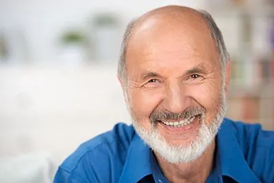 man with dental implants smiling