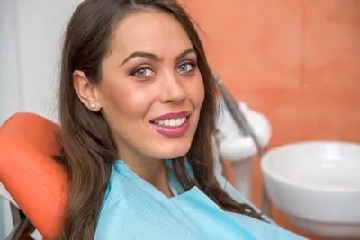 patient smiling showing off her new dental veneers