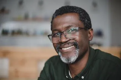 man with dentures smiling