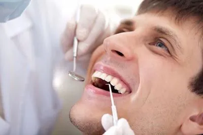 patient receiving a root planing procedure