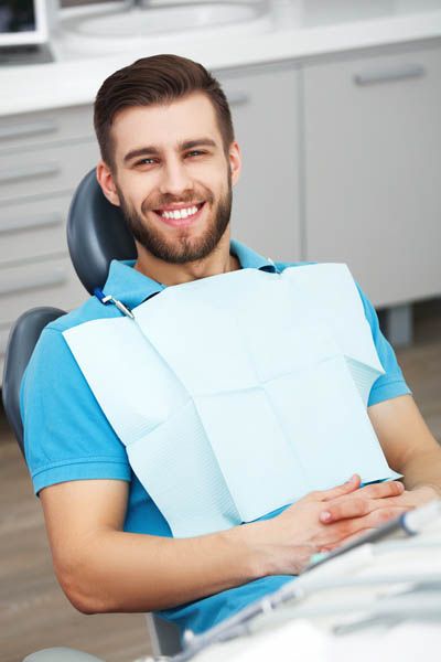 man smiling during his first visit at Prosthodontic Associates of New Jersey