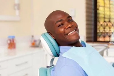 patient smiling after his oral surgery procedure at Prosthodontic Associates of New Jersey